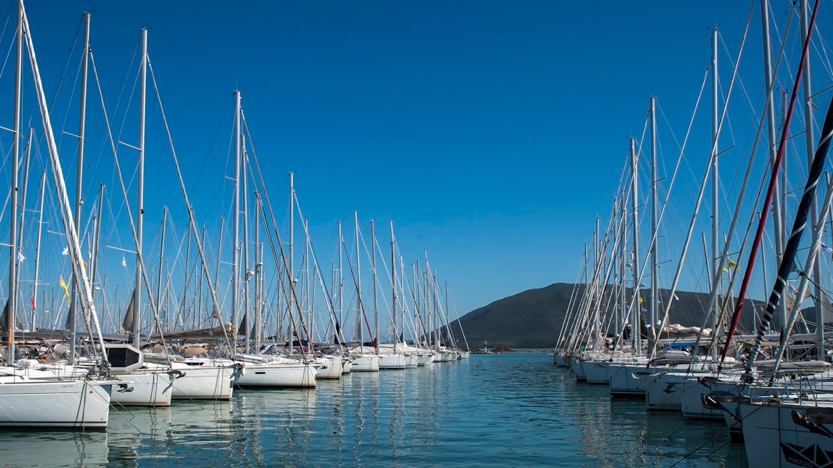 Surveyor inspecting hull of used sailboat