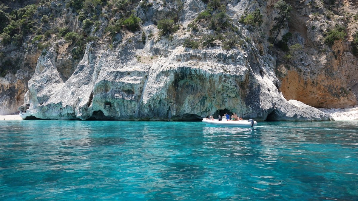 Cruising catamaran at anchor in a Mediterranean cove