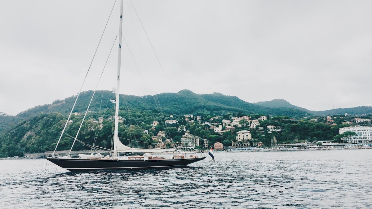Sailing yacht entering a Mediterranean harbour